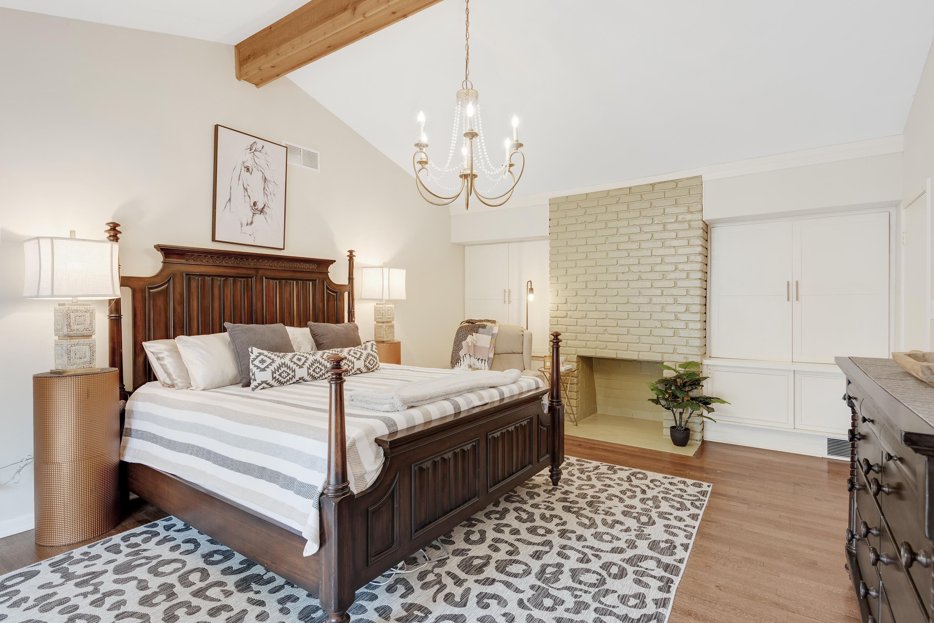 5585 Walnut Grove Road Memphis, TN 38120 - Photo 15 of 25 a bedroom with bed and wooden floor