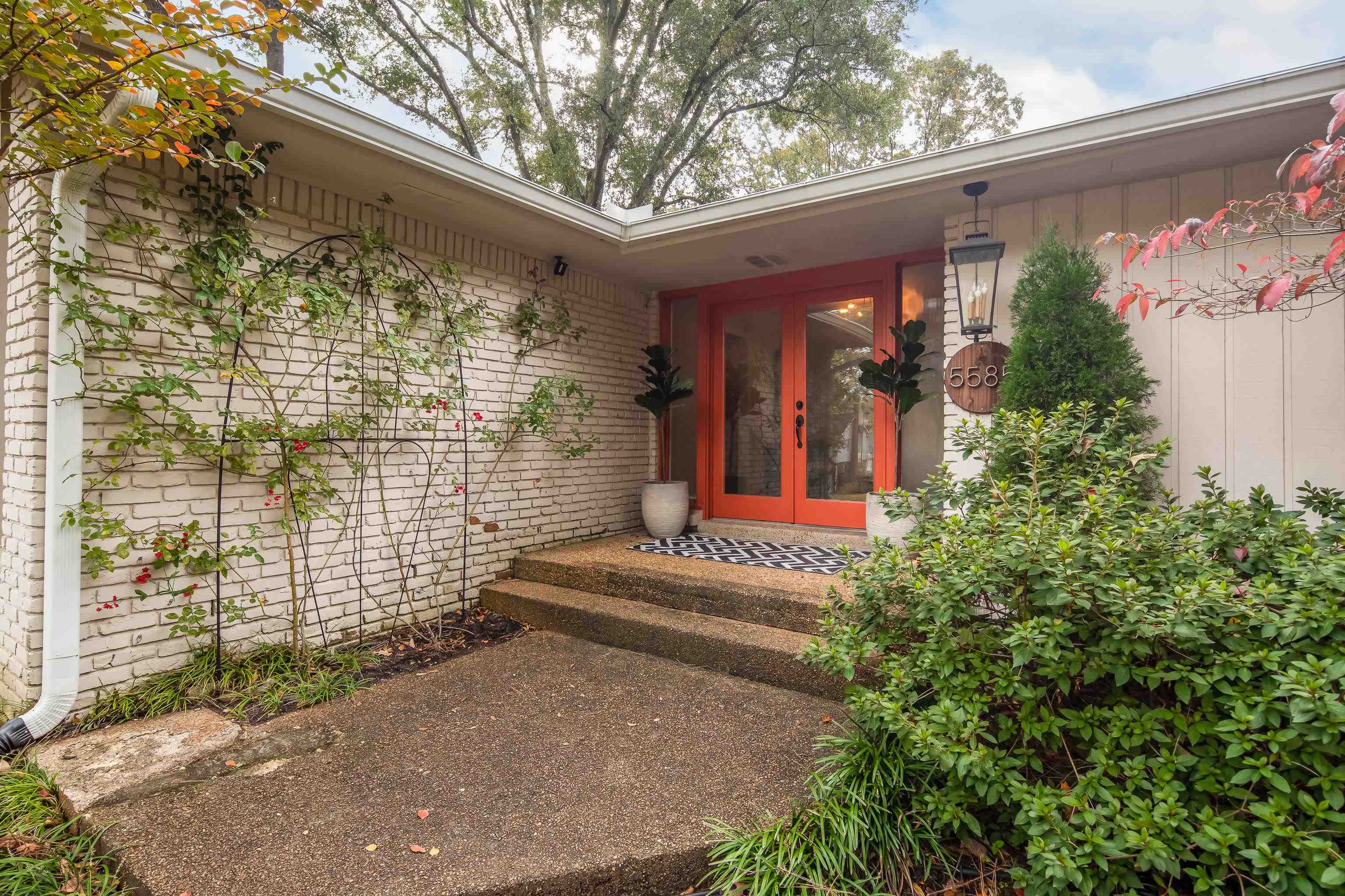 5585 Walnut Grove Road Memphis, TN 38120 - Photo 2 of 25 a view of a house with potted plants
