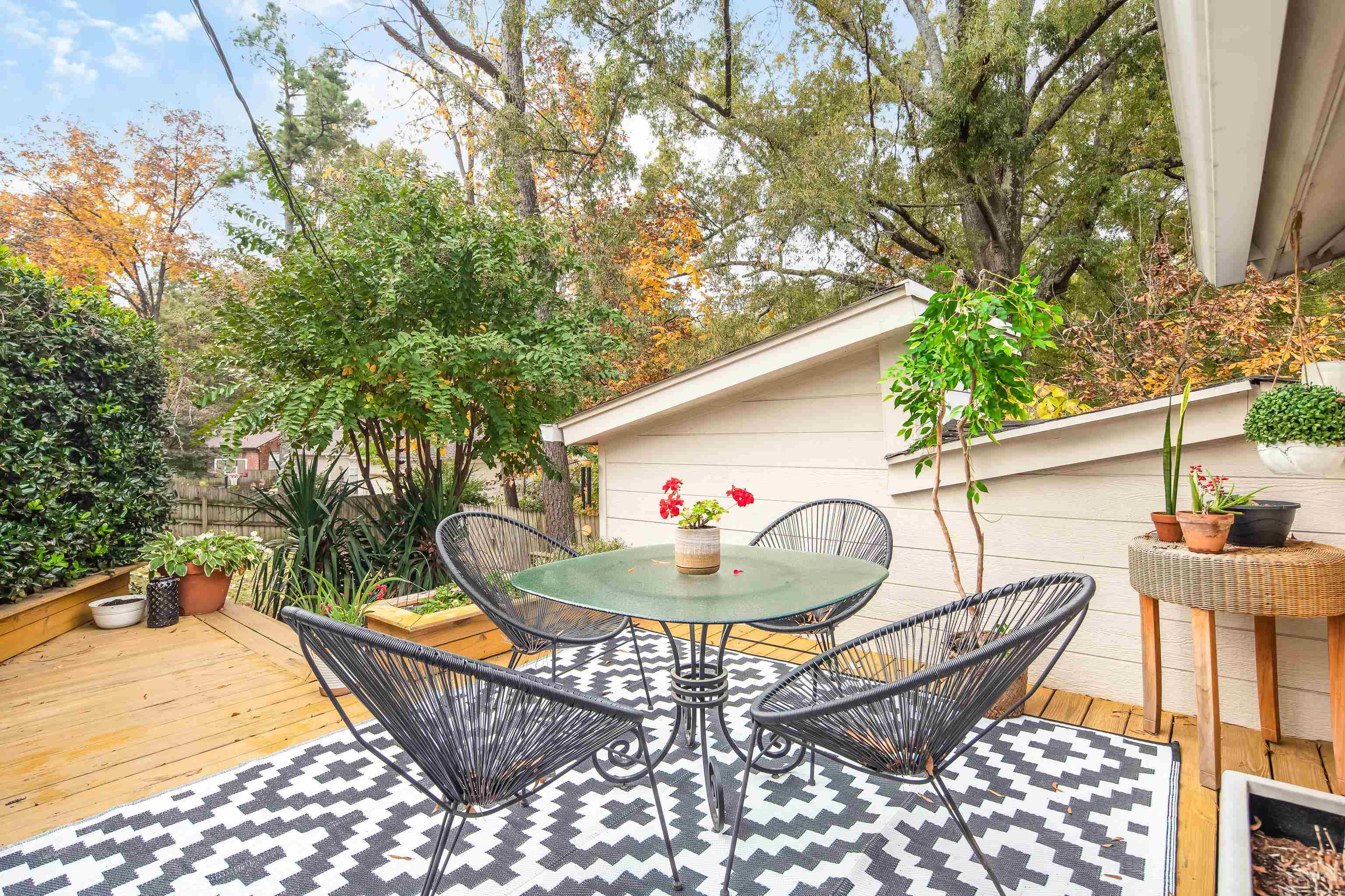 5585 Walnut Grove Road Memphis, TN 38120 - Photo 21 of 25 a backyard of a house with table and chairs