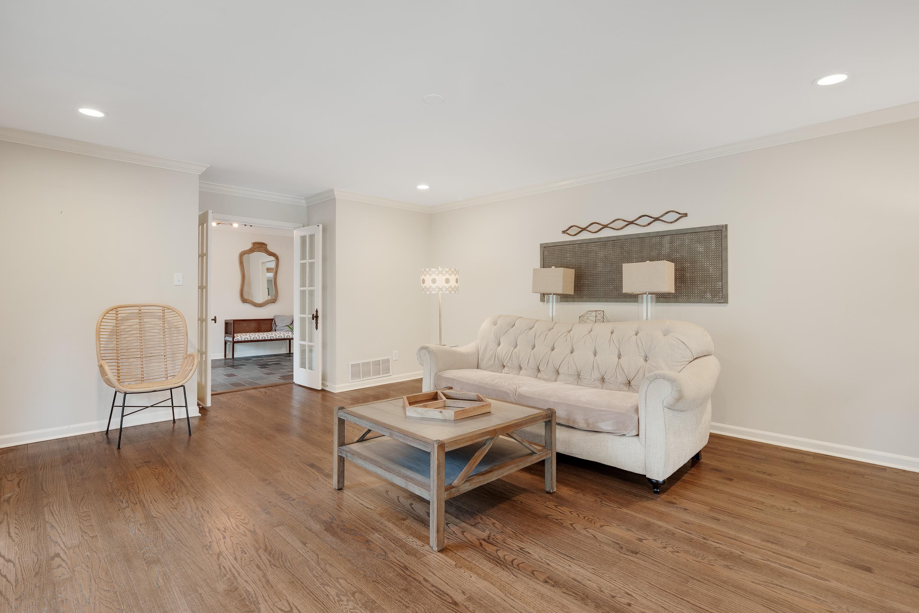 5585 Walnut Grove Road Memphis, TN 38120 - Photo 6 of 25 a living room with furniture and a wooden floor