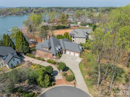 an aerial view of residential house with outdoor space and lake view