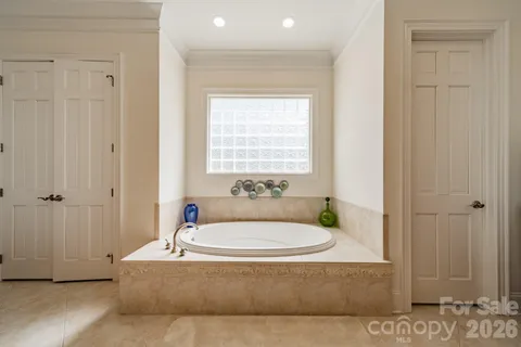 a bathroom with a tub and shower