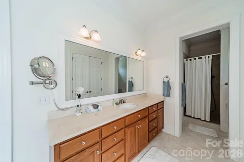 a spacious bathroom with a double vanity sink and a mirror