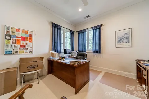 a room with a stove a sink and a window