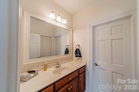 a bathroom with a sink double vanity and a mirror