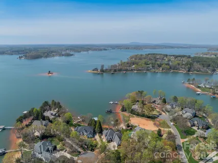 an aerial view of a houses with ocean view