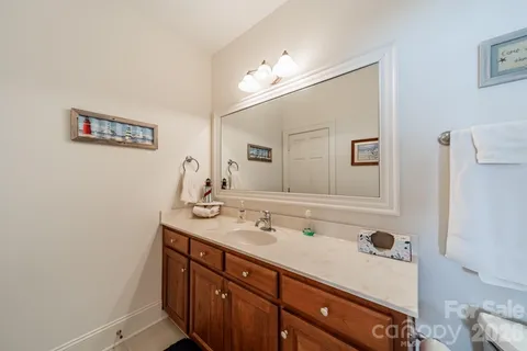 a bathroom with a sink a vanity and a mirror