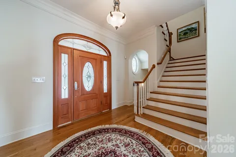 a view of entryway with wooden floor