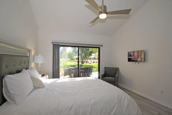 a bedroom with a large bed and a window