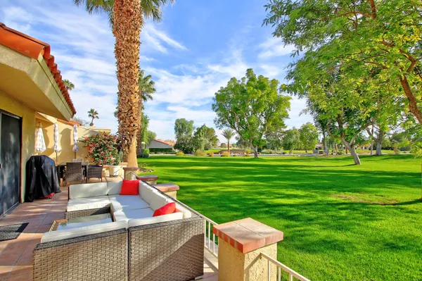 a view of a park with large trees