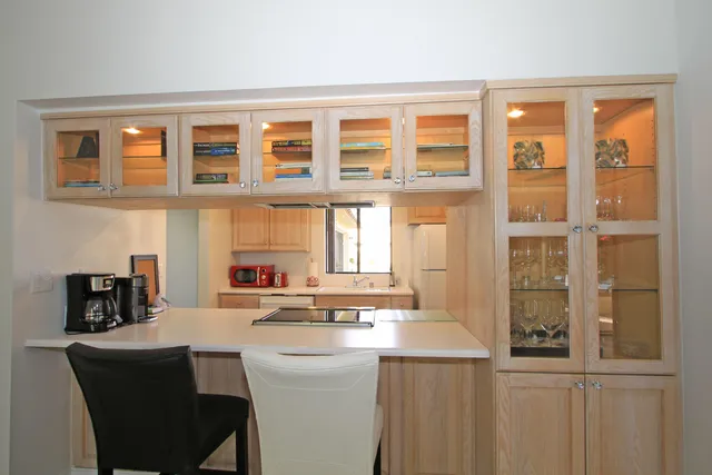 a room that has a sink and a large window in it