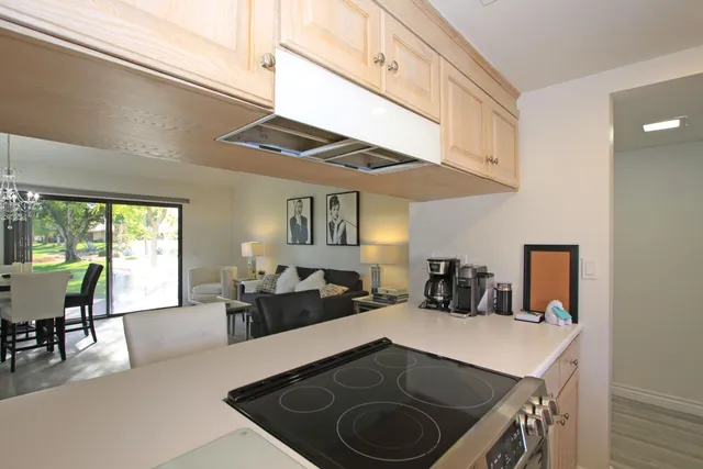 a kitchen with a table and chairs