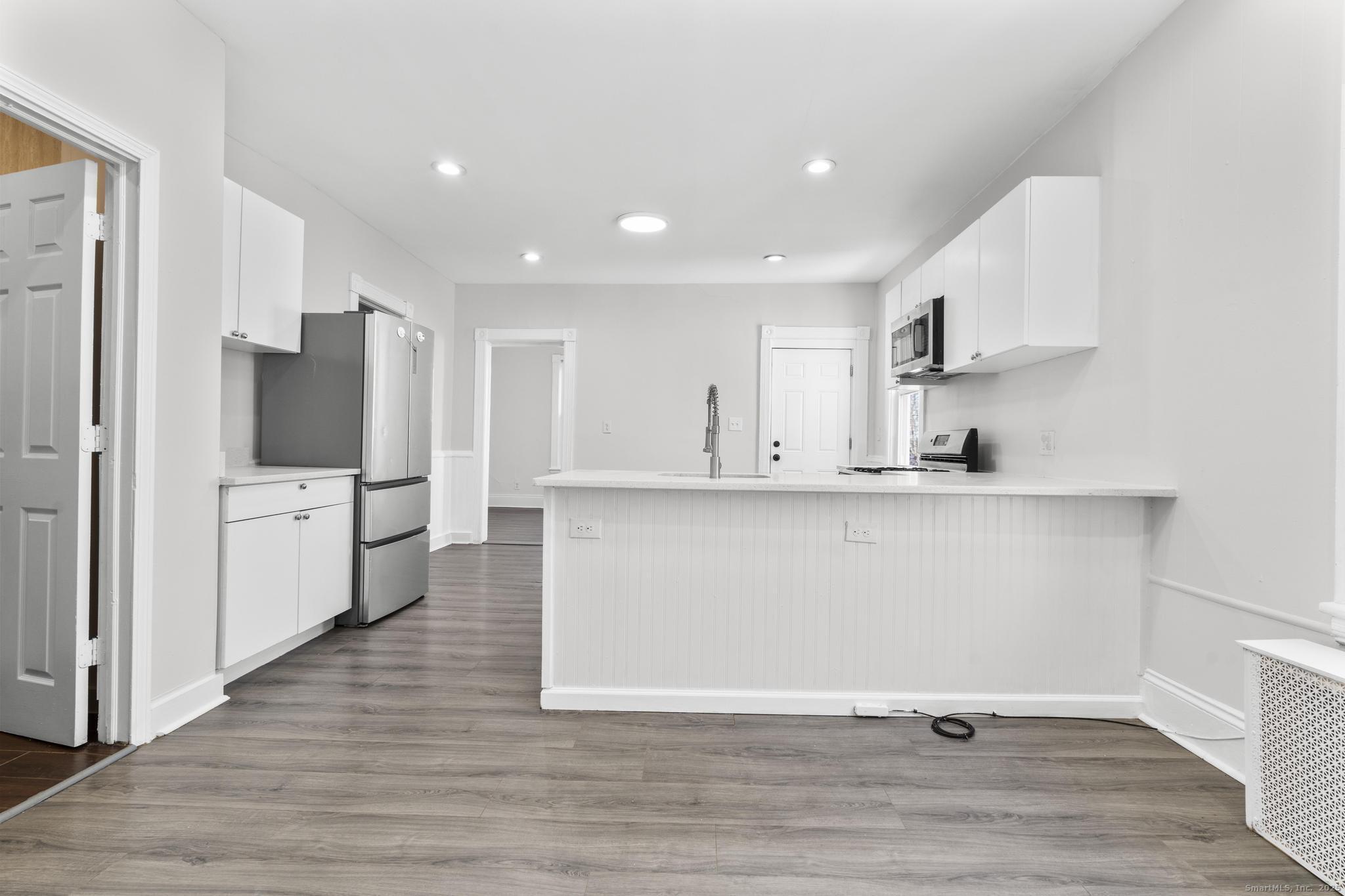 394 Gregory Street, Unit 4 Bridgeport, CT 06604 - Photo 13 of 23 a view of kitchen with stainless steel appliances refrigerator oven and stove