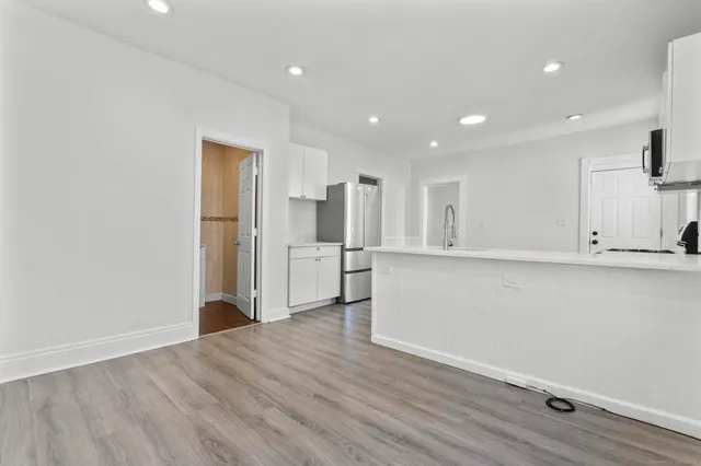 a view of kitchen with wooden floor