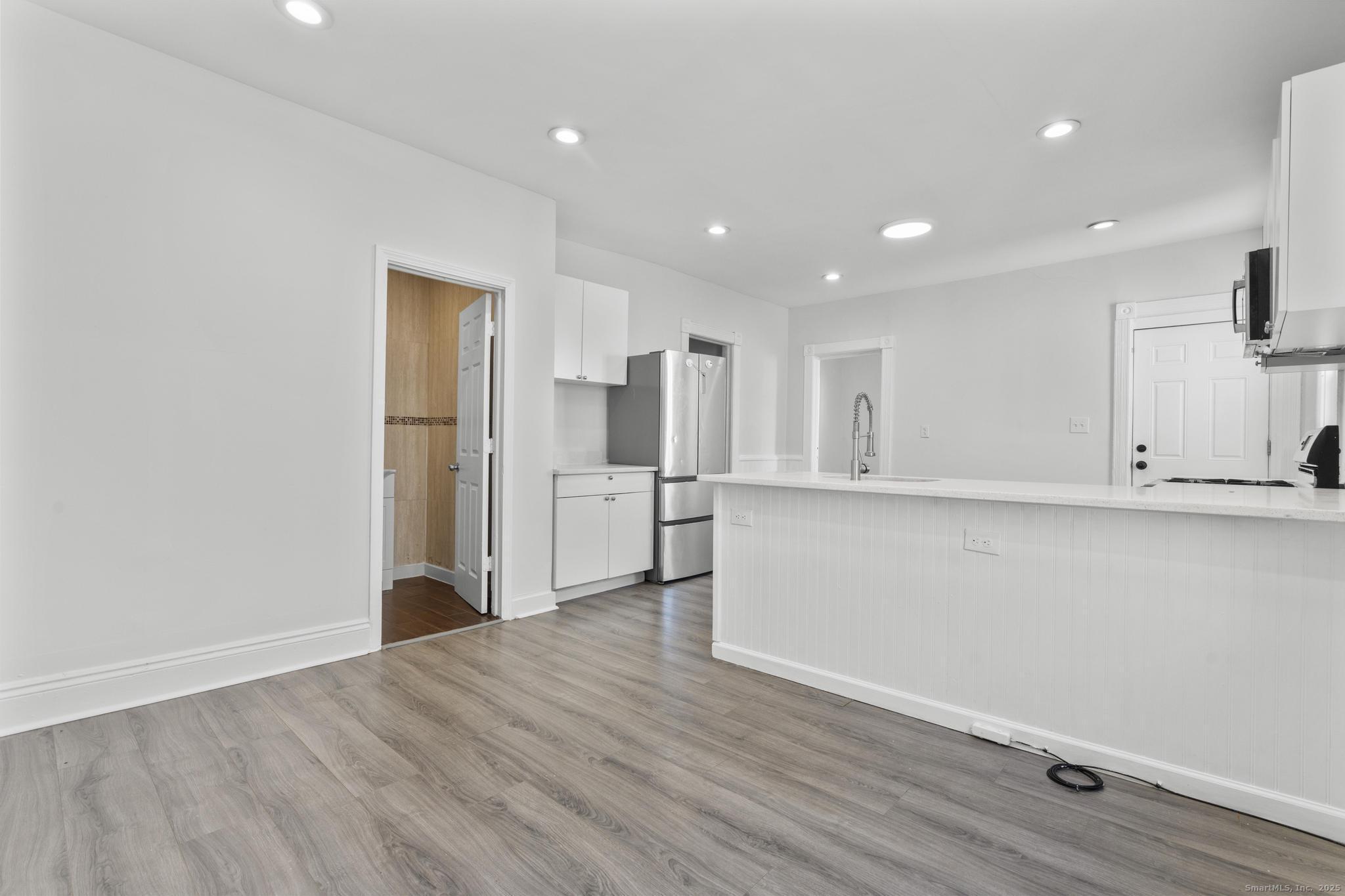 394 Gregory Street, Unit 4 Bridgeport, CT 06604 - Photo 14 of 23 a view of kitchen with wooden floor