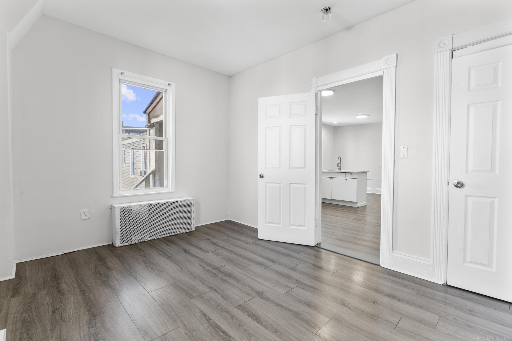 394 Gregory Street, Unit 4 Bridgeport, CT 06604 - Photo 17 of 23 wooden floor in an empty room