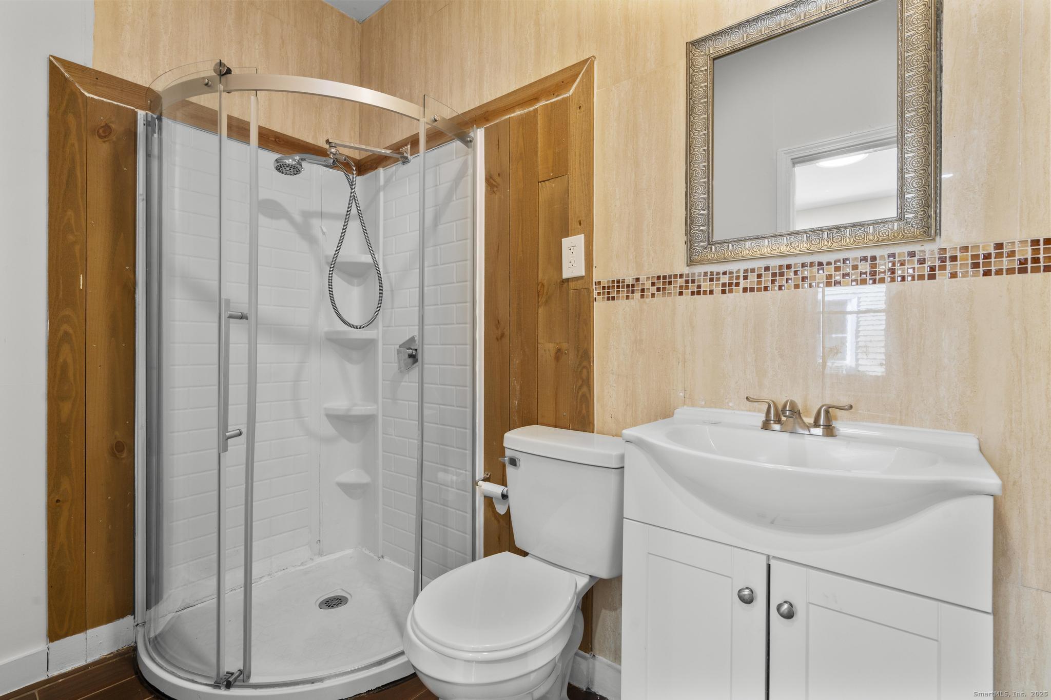 394 Gregory Street, Unit 4 Bridgeport, CT 06604 - Photo 7 of 23 a bathroom with a sink a toilet and shower