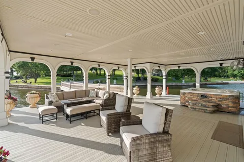 a living room with furniture and large windows