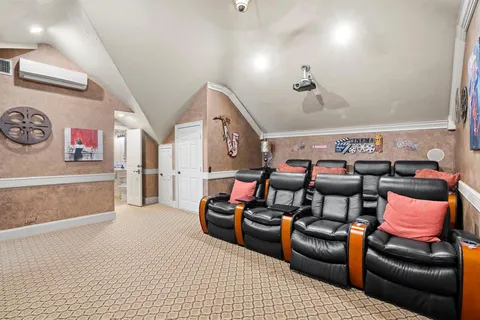 a bedroom with a bed and large mirror with a potted plant