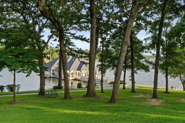 an aerial view of a house with a lake view