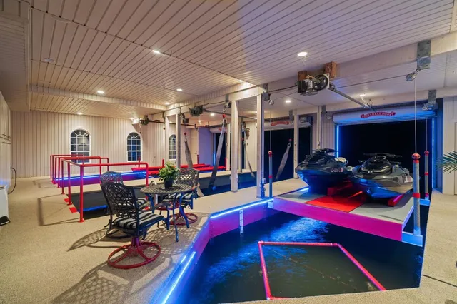 a bed room with a bed and a chandelier