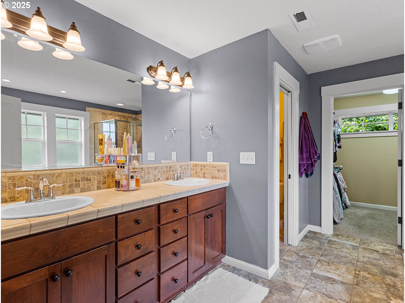 179 Southeast 46th Drive Gresham, OR 97080 - Photo 19 of 39 a spacious bathroom with a granite countertop sink a mirror and a shower