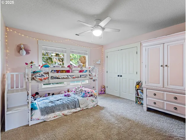 a bathroom with a granite countertop sink a large mirror and a shower