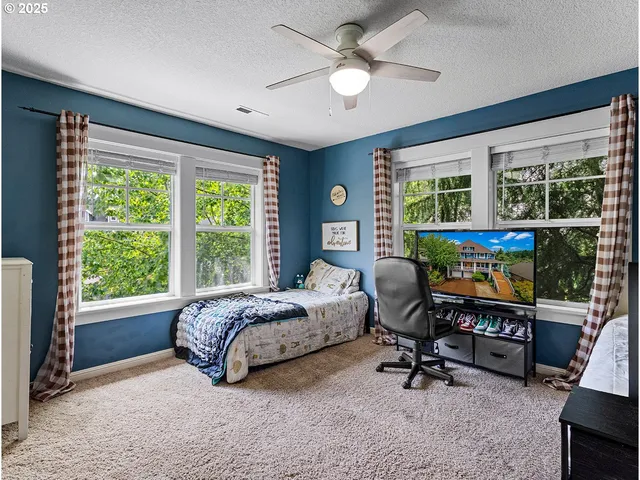 a room with furniture and a large window