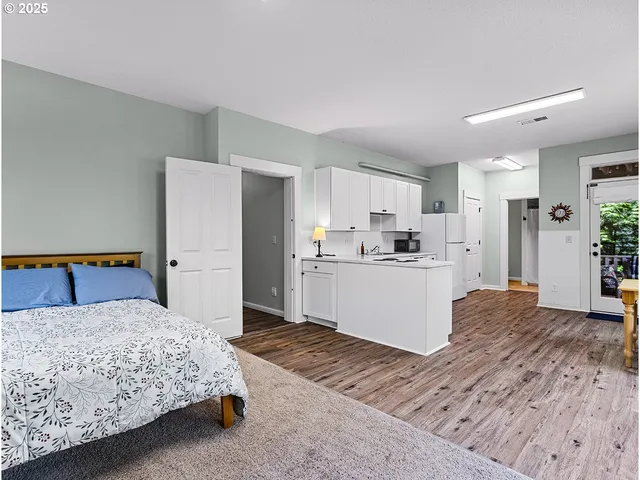 a living room with furniture and large window