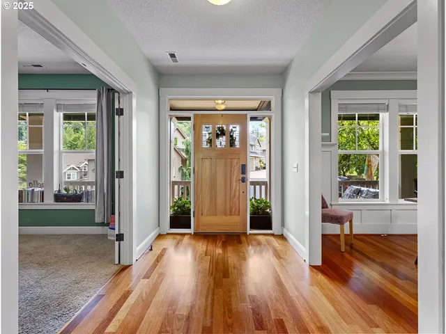 a view of a livingroom with furniture and a ceiling fan