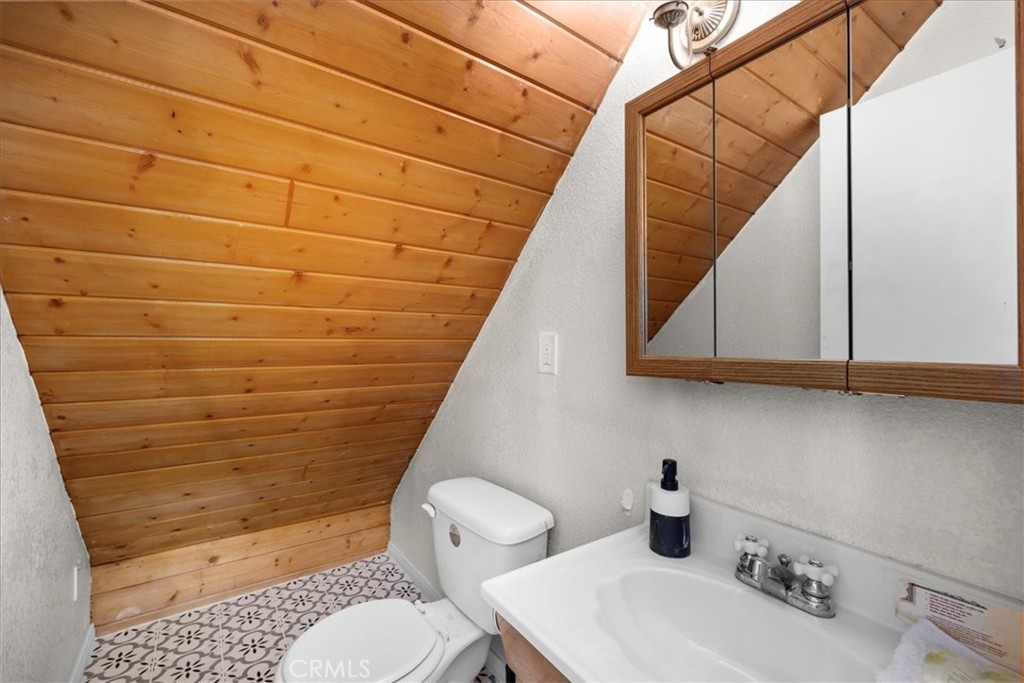 113 East Fairway Boulevard Big Bear City, CA 92314 - Photo 15 of 36 a bathroom with a sink toilet and shower