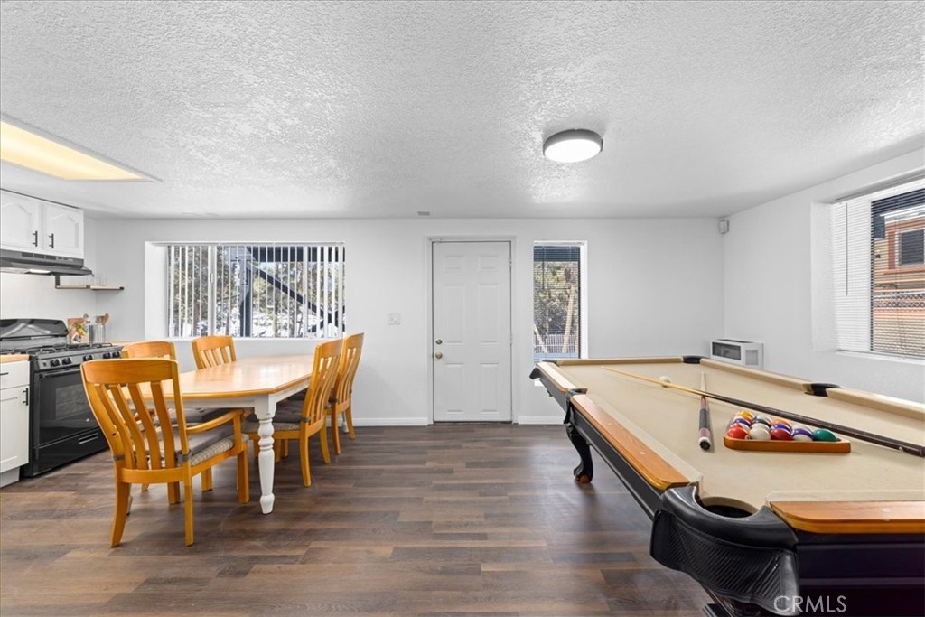113 East Fairway Boulevard Big Bear City, CA 92314 - Photo 29 of 36 a dining room with furniture and wooden floor