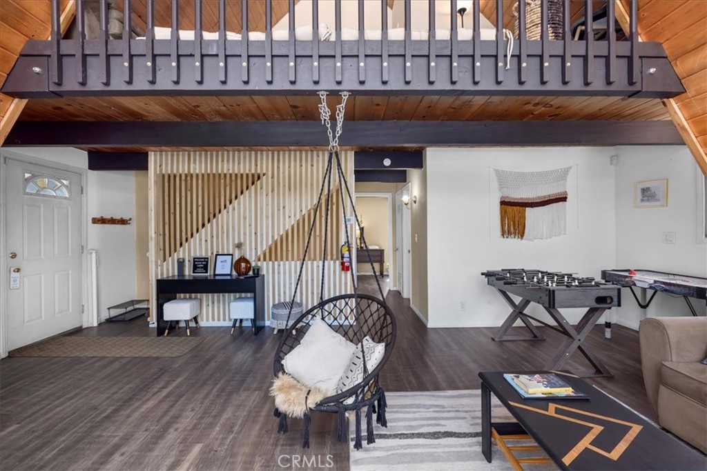 113 East Fairway Boulevard Big Bear City, CA 92314 - Photo 9 of 36 a view of balcony with two chairs and wooden floor