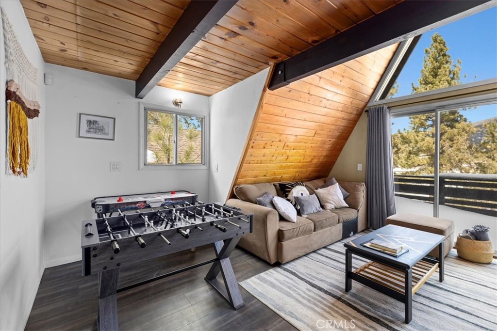 113 East Fairway Boulevard Big Bear City, CA 92314 - Photo 10 of 36 a living room with furniture and a window