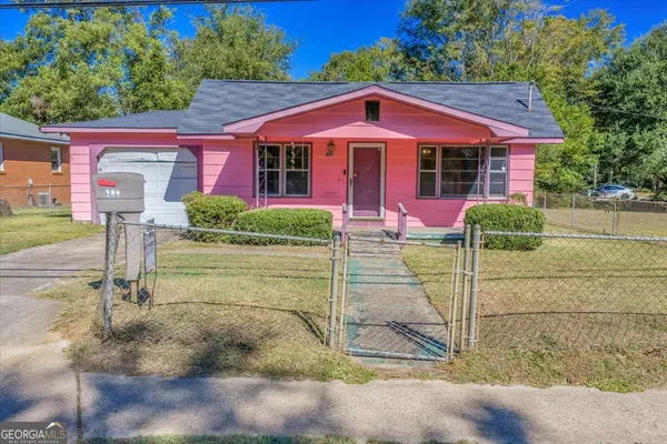 a front view of a house with yard
