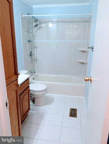 a bathroom with a toilet a sink and bathtub