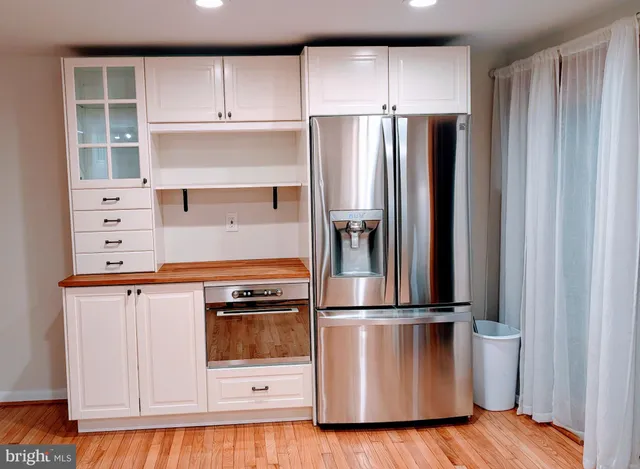 a kitchen with appliances and cabinets