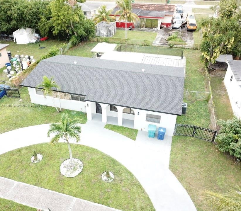 17110 Northwest 11th Avenue Miami Gardens, FL 33169 - Photo 2 of 38 a view of swimming pool with a yard
