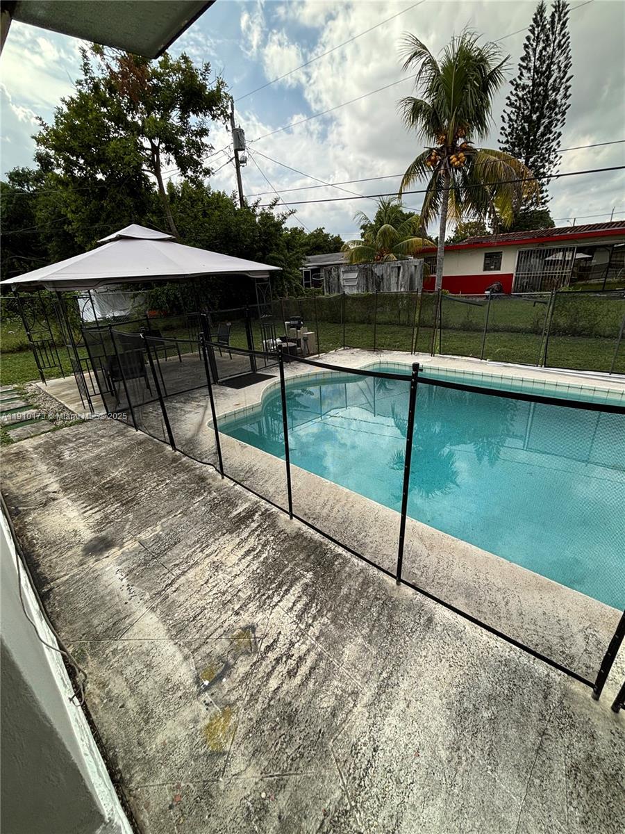 17110 Northwest 11th Avenue Miami Gardens, FL 33169 - Photo 27 of 38 a view of a lake with a yard and sitting area
