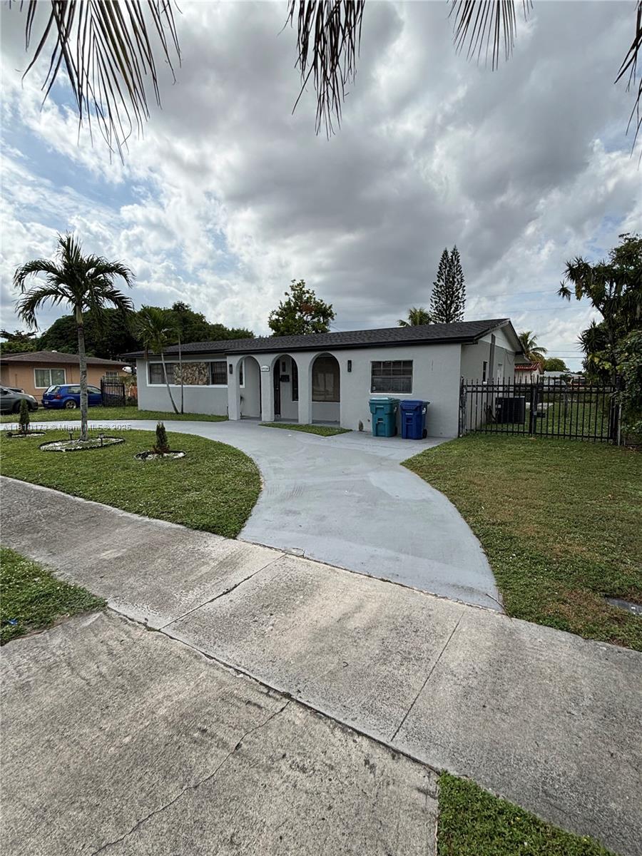 17110 Northwest 11th Avenue Miami Gardens, FL 33169 - Photo 33 of 38 a view of a house with a yard