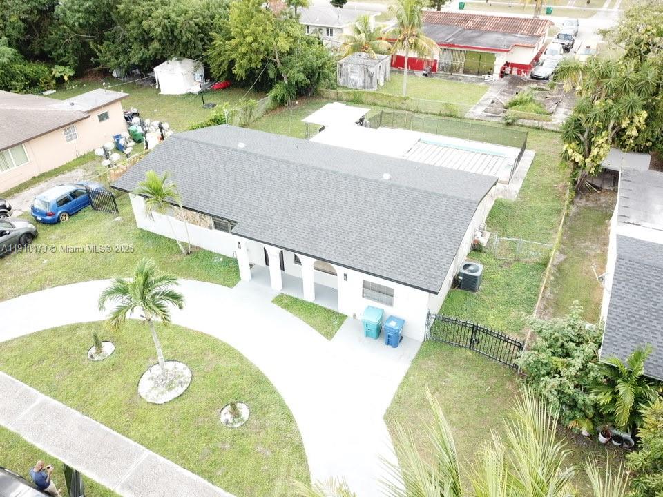 17110 Northwest 11th Avenue Miami Gardens, FL 33169 - Photo 34 of 38 a view of swimming pool with a yard