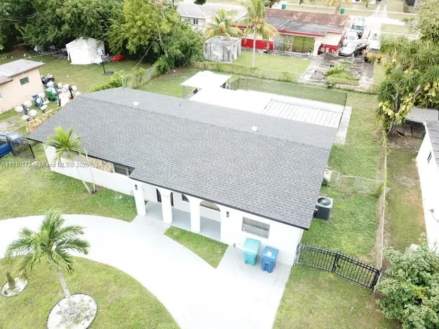 a view of swimming pool with a yard