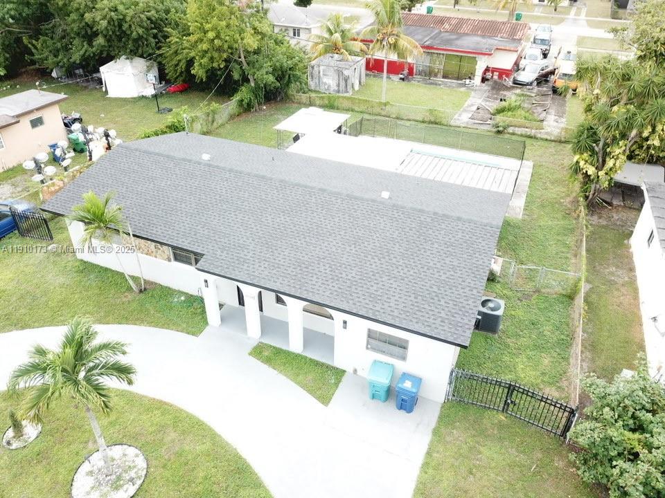17110 Northwest 11th Avenue Miami Gardens, FL 33169 - Photo 35 of 38 a view of swimming pool with a yard