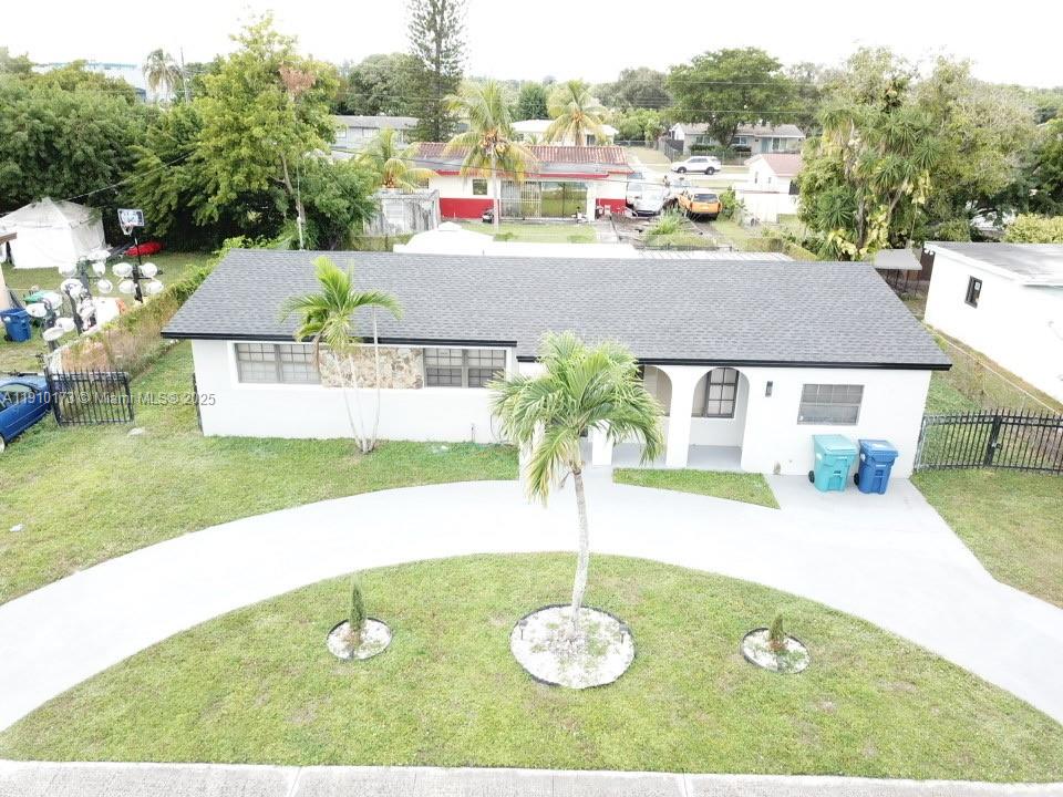 17110 Northwest 11th Avenue Miami Gardens, FL 33169 - Photo 37 of 38 a view of swimming pool with a yard