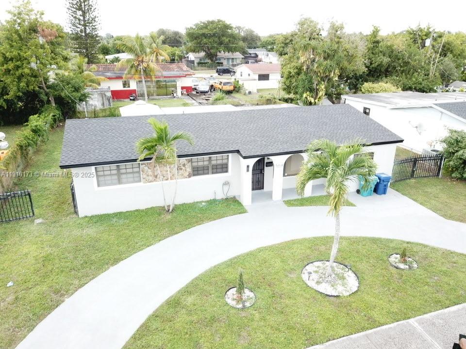 17110 Northwest 11th Avenue Miami Gardens, FL 33169 - Photo 38 of 38 a view of a house with a swimming pool