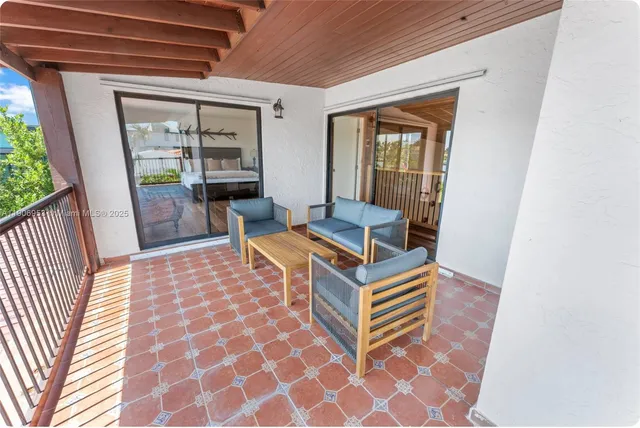 a room with wooden floor and furniture