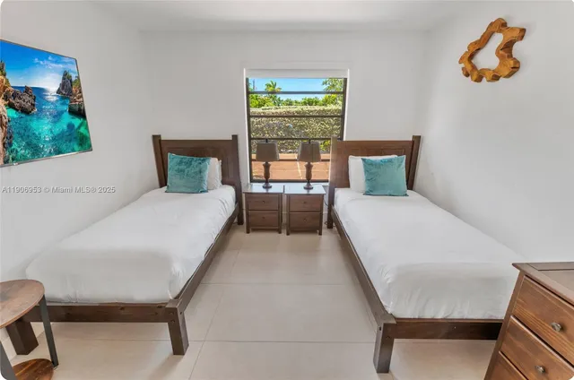 a bed room with a bed and a chair