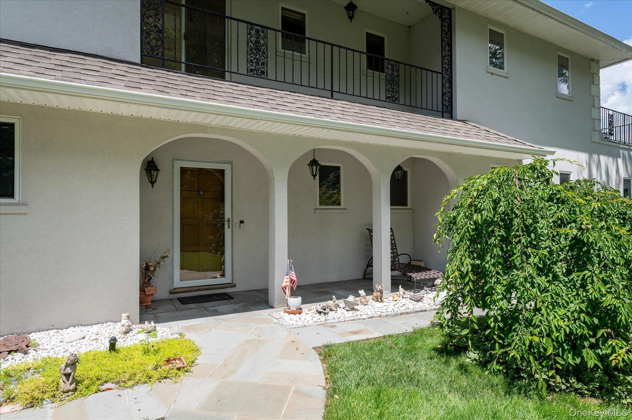 41 Tamarack Road Mahopac, NY 10541 - Photo 10 of 41 The arched entry portico and heated paver driveway set the tone from the moment you arrive