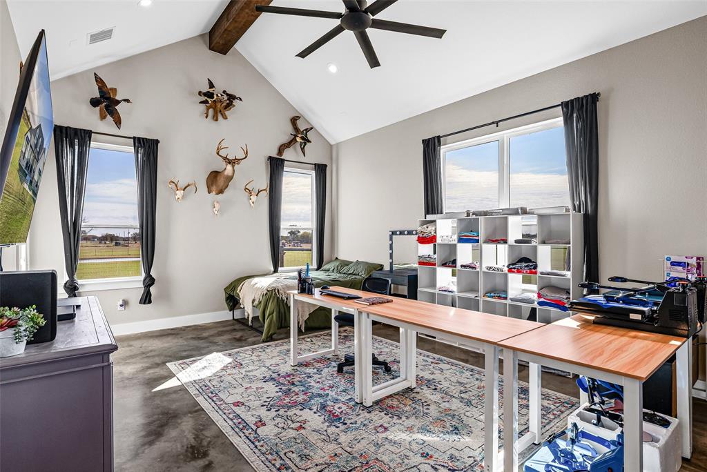 310 Runyan Rnch Road Tolar, TX 76476 - Photo 22 of 35 Home office featuring concrete flooring, healthy amount of natural light, beam ceiling, high vaulted ceiling, and ceiling fan