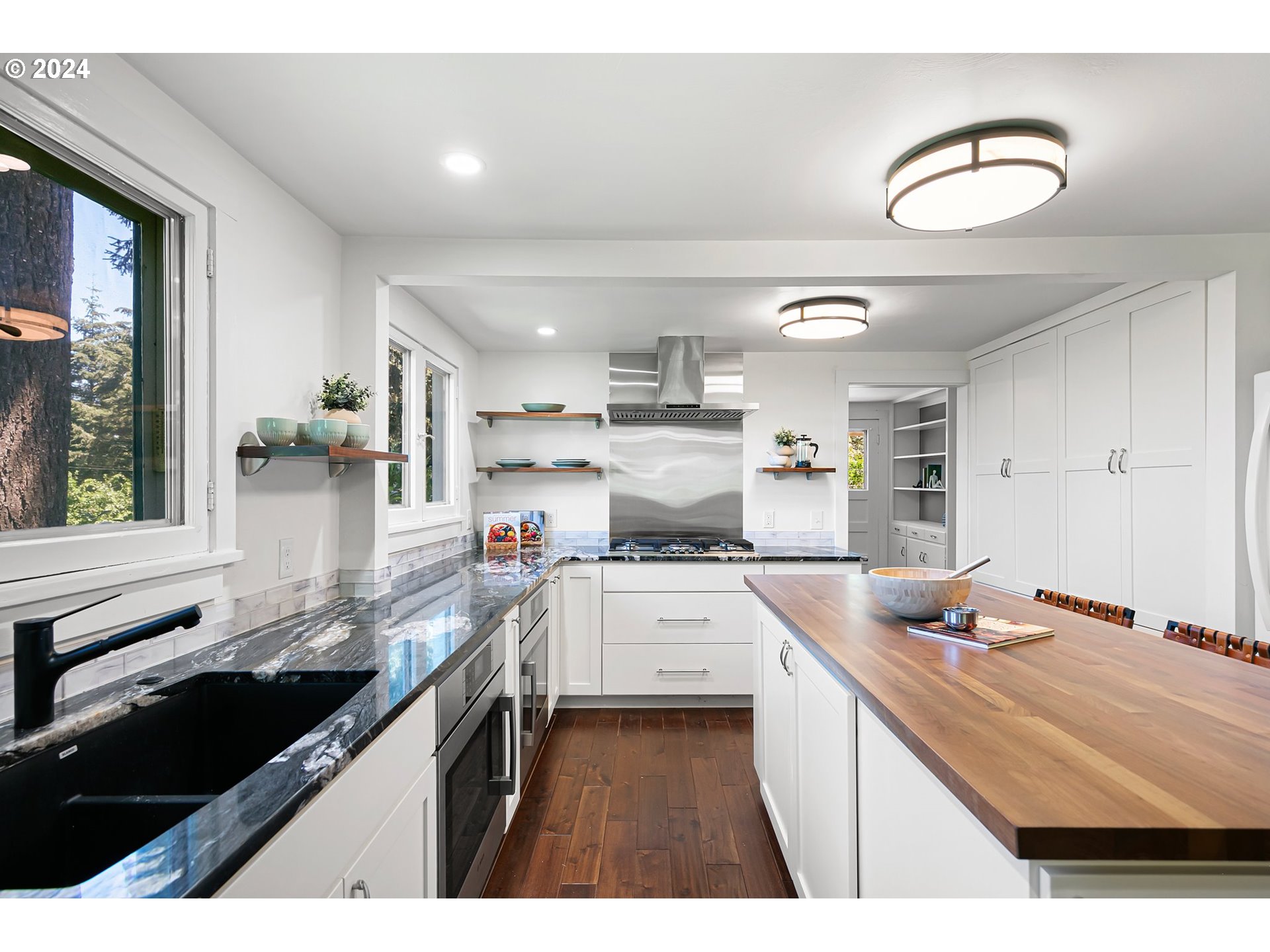 2919 Jefferson Street Eugene, OR 97405 - Photo 13 of 38 a kitchen that has a lot of cabinets in it